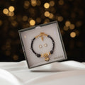 Set pulsera y aretes Guess